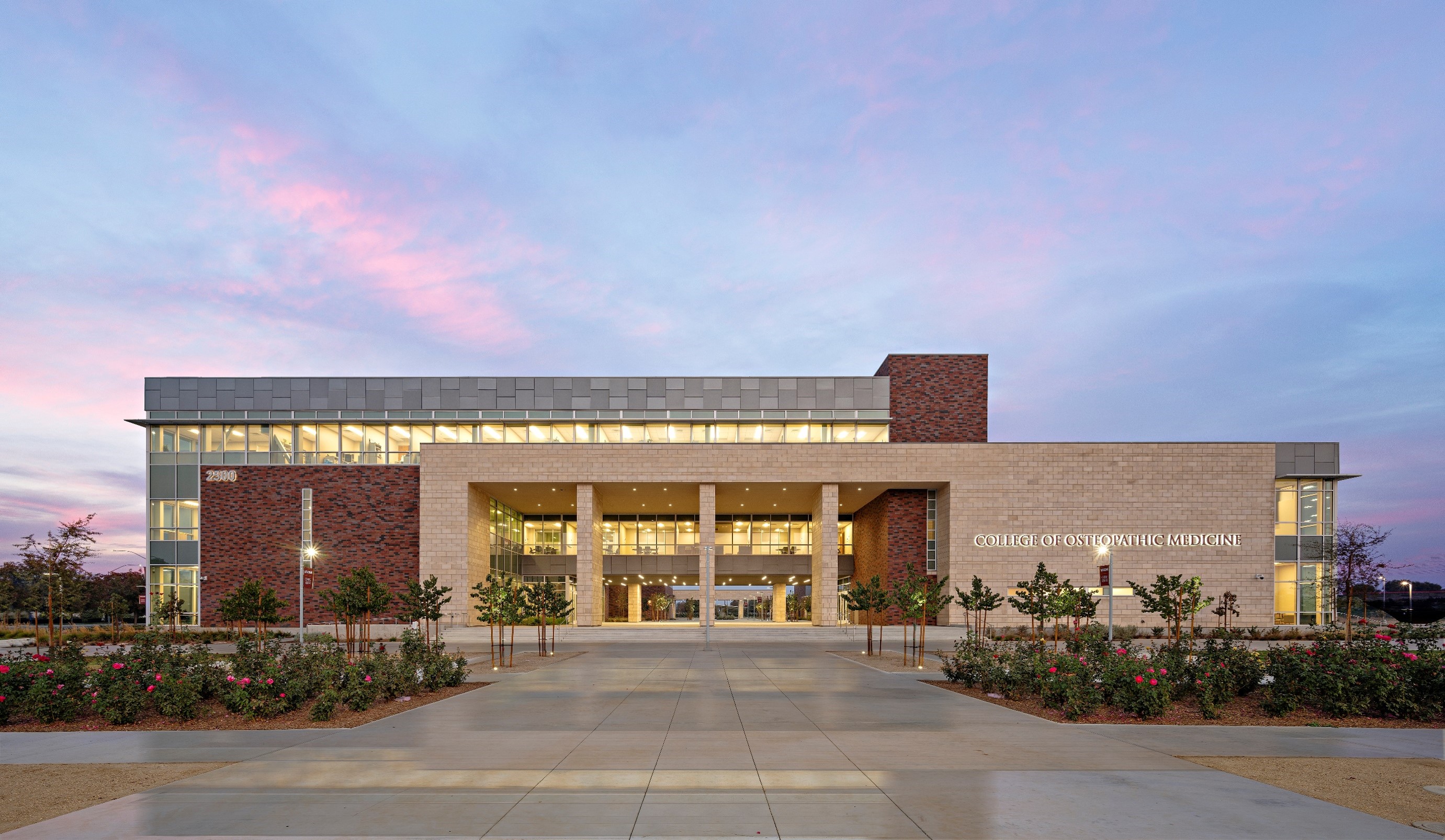 View of a building at dusk located at California Health Sciences University College of Osteopathic Medicine