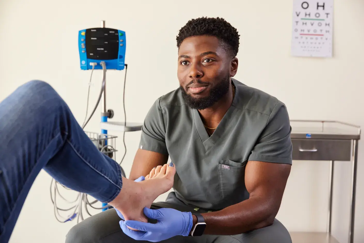Student at Samuel Merritt University College of Podiatric Medicine performing a foot assessment.
