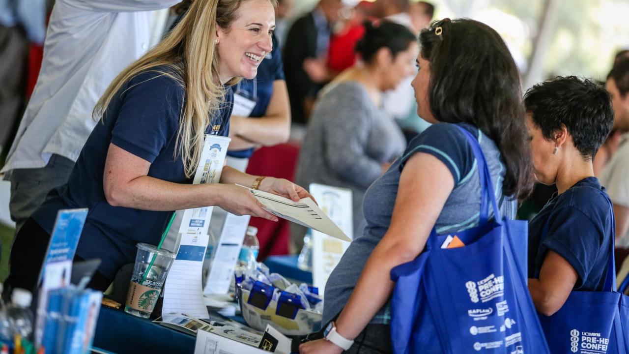 School representative smiling with prospective student