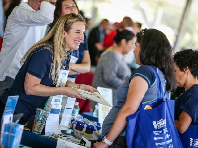 School representative smiling with prospective student