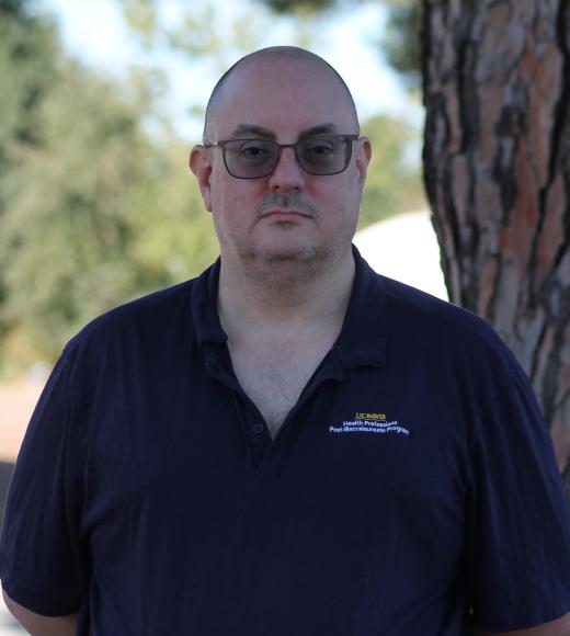 Headshot of Doug.